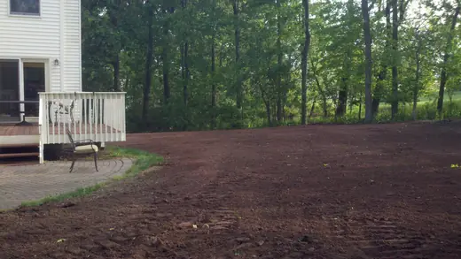 The same residential backyard after grading, finished and level